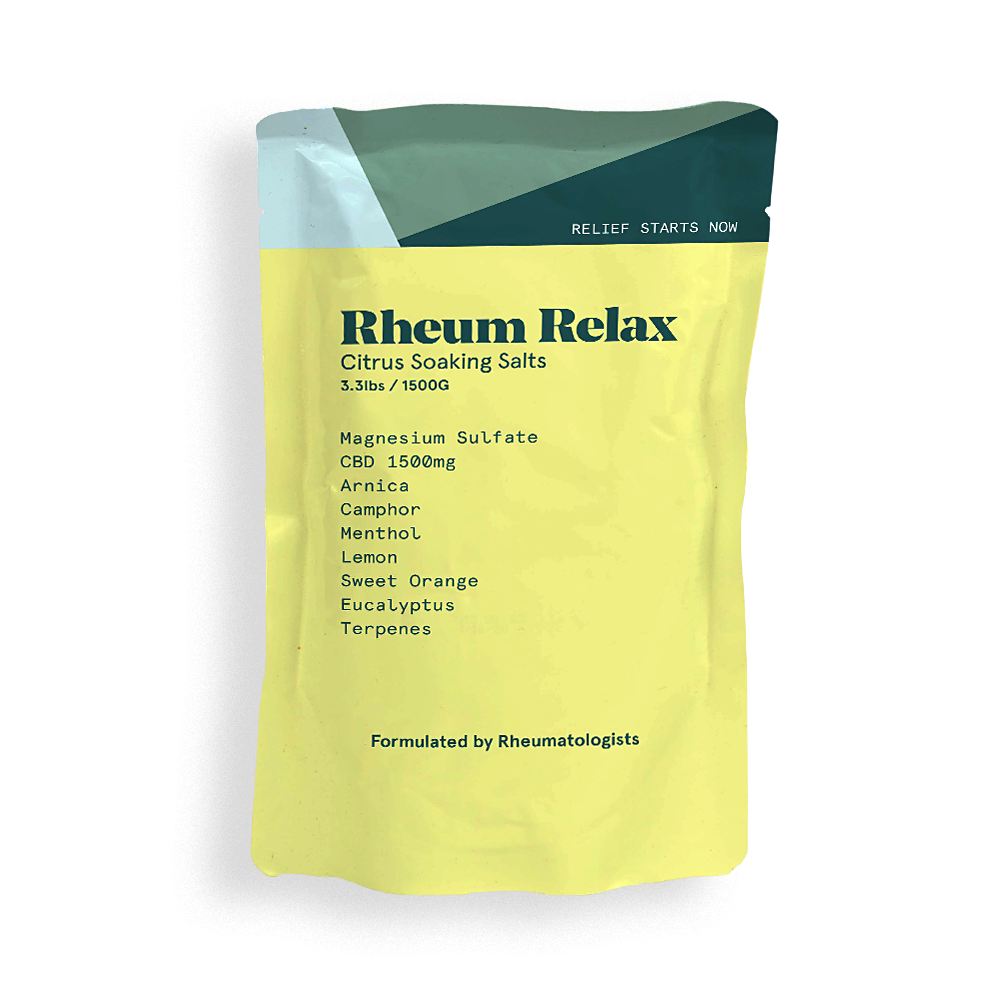 Yellow package of Rheum Relax Citrus Soaking Salts with green top on a white background