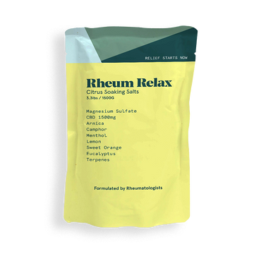 Yellow package of Rheum Relax Citrus Soaking Salts with green top on a white background