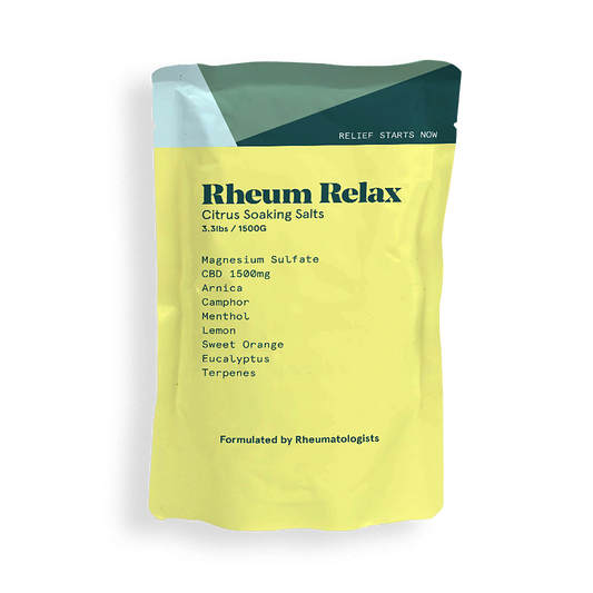 Yellow package of Rheum Relax Citrus Soaking Salts with green top on a white background